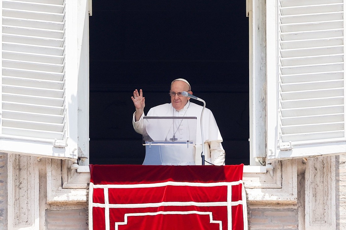 Pope Francis greets visitors gathered in St. Peter's Square at the Vatican to pray the Angelus July 16, 2023. (CNS photo/Lola Gomez)