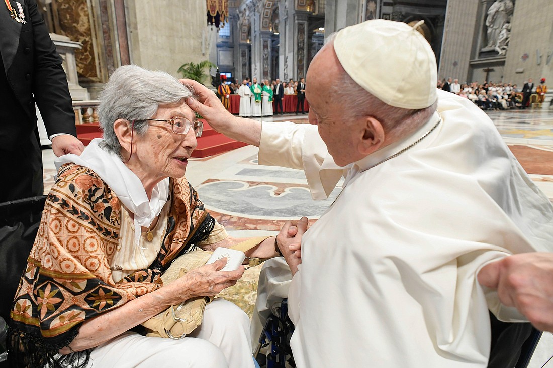 Pope Francis greets 100-year-old Lucilla Macelli before celebrating Mass in St. Peter’s Basilica at the Vatican, marking World Day for Grandparents and the Elderly July 23, 2023. (CNS photo/Vatican Media)