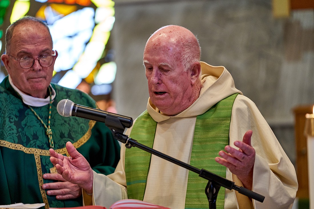 With Bishop David M. O’Connell, C.M., at left, Father Robert F. Kaeding concelebrates Father Brian Butch’s installation Mass June 25 in St. Anselm Parish, Wayside.  Vic Mistretta photo