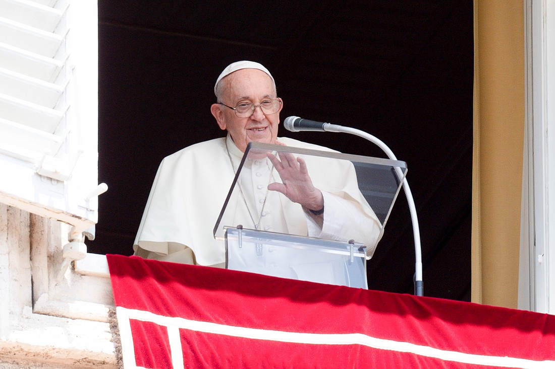 Pope Francis smiles and waves at visitors gathered in St. Peter's Square at the Vatican after praying the Angelus July 30, 2023. (CNS photo/Vatican Media)