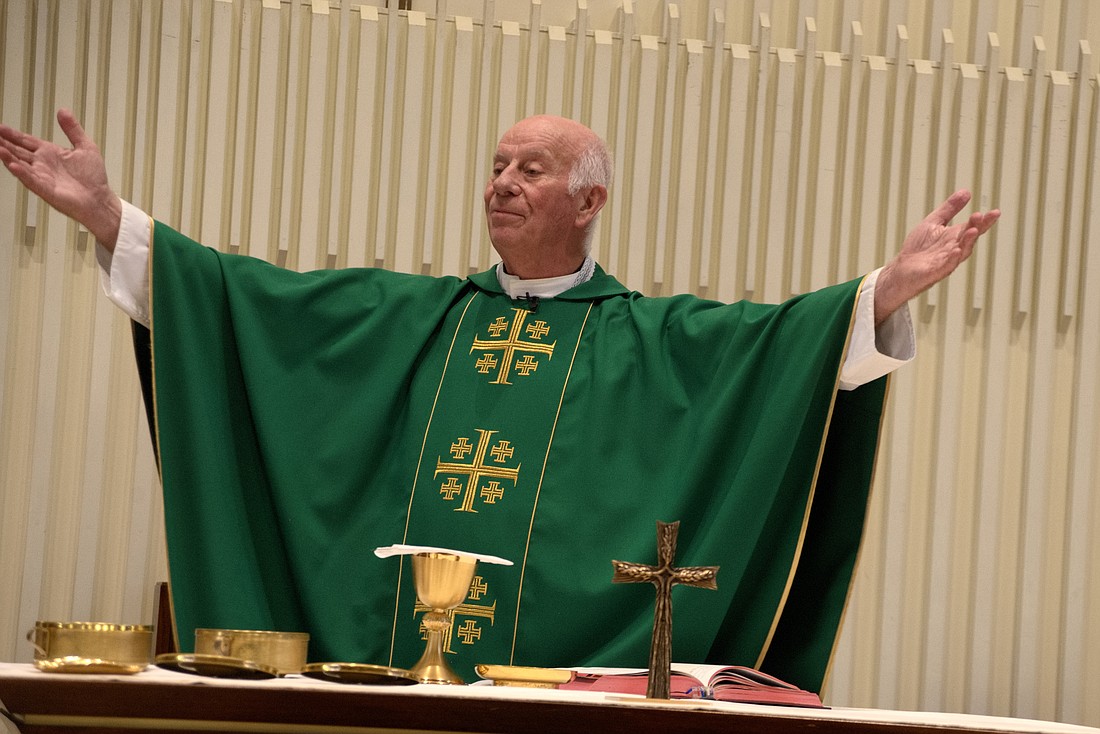 Msgr. Michael J. Walsh celebrates Mass in St. Catharine Church, Holmdel, where in retirement he has be-come a weekend assistant. Hal Brown photo