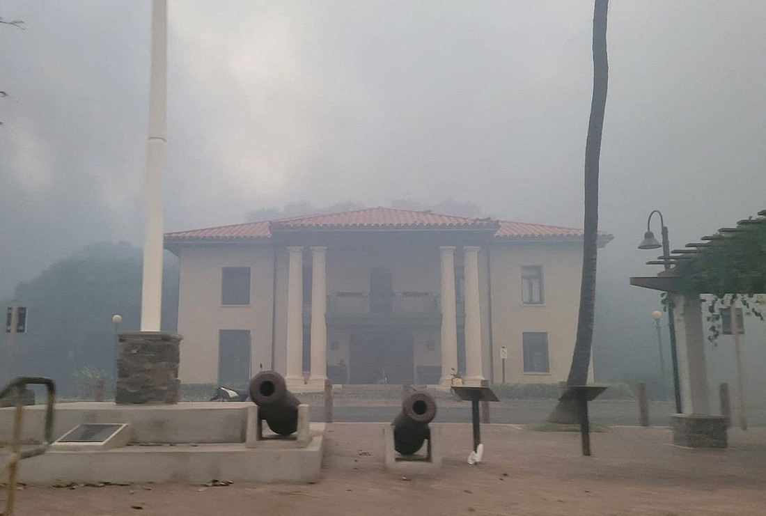 Smoke obscures an old courthouse Aug. 9, 2023, as wildfires driven by high winds destroy a large part of the historic town of Lahaina, Hawaii, on the island of Maui. OSV News photo/Dustin Johnson, Handout via Reuters