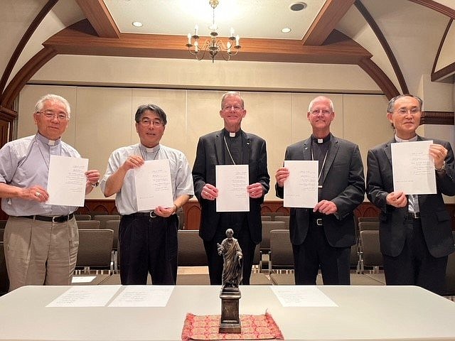 The signatories of an Aug. 9, 2023, declaration to work together toward abolition of nuclear weapons are, from left, retired Archbishop Joseph Mitsuaki Takami of Nagasaki, Japan; Archbishop Peter Michiaki Nakamuru of Nagasaki; Archbishop John C. Wester of Santa Fe, New Mexico; Archbishop Paul D. Etienne of Seattle; and Bishop Alexis Mitsuru Shirahama of Hiroshima, Japan. The pledge was signed in Nagasaki on the 78th anniversary of the Aug. 9, 1945, atomic bombing of the city. (OSV News photo/courtesy Archdiocese of Seattle)