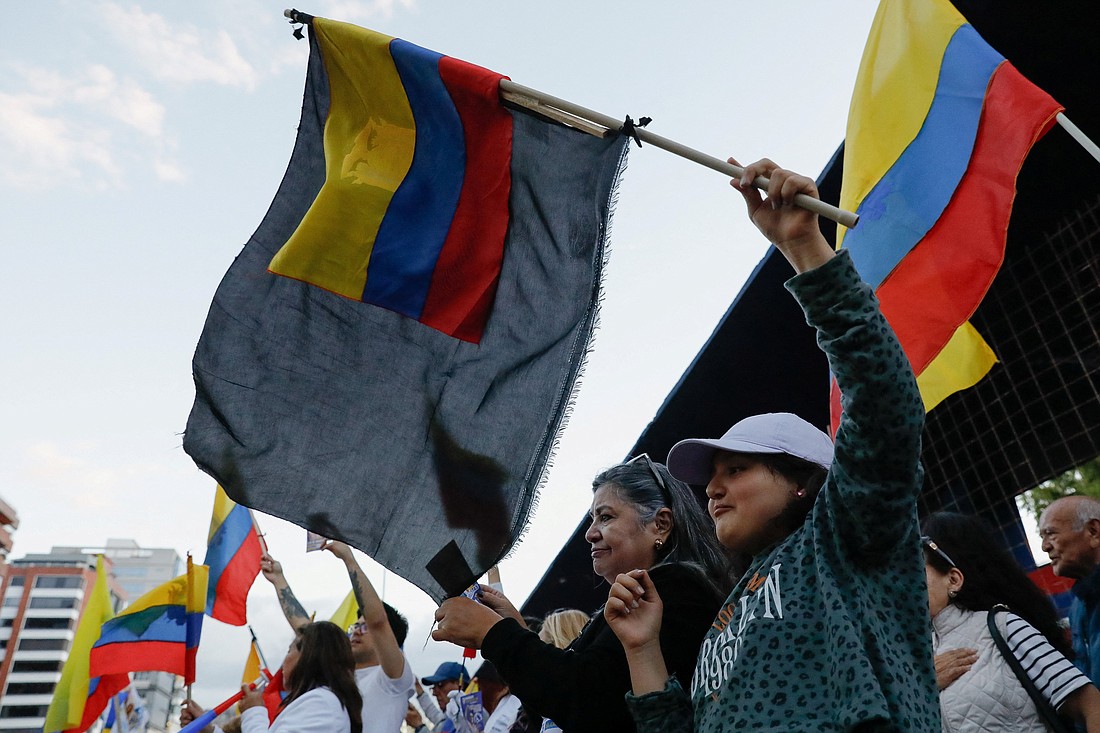 People wave Ecuadorian flags during a demonstration following the killing of Ecuadorian presidential candidate Fernando Villavicencio Aug. 9, 2023, in in Quito, Ecuador. Villavicencio, who was killed at a campaign event, was a vocal critic of corruption and organized crime. (OSV News photo/Karen Toro, Reuters)