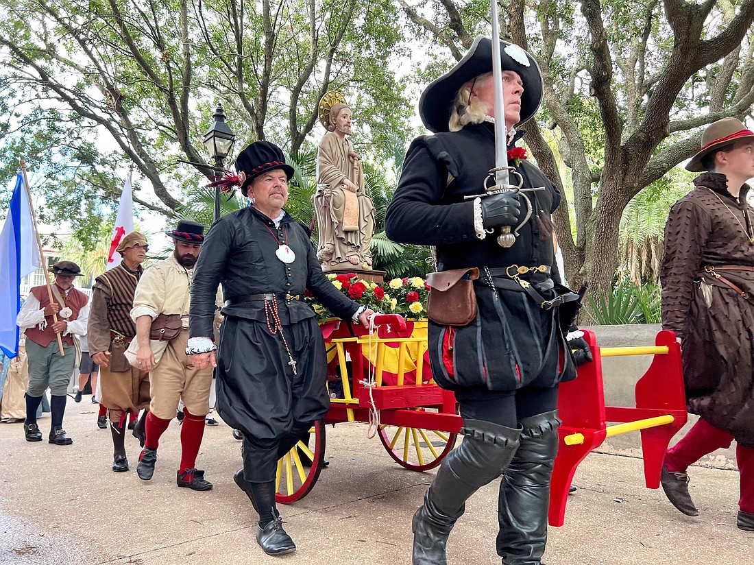 A procession in downtown St. Augustine, Fla., takes a statute of St. James (Apostle Santiago) from the Castillo de San Marcos, a Spanish-built masonry fort dating to the late 1600s, to its new home in the Cathedral Basilica of St. Augustine a few blocks away July 25, 2023. (OSV News photo/Jessica Larson, St. Augustine Catholic)
