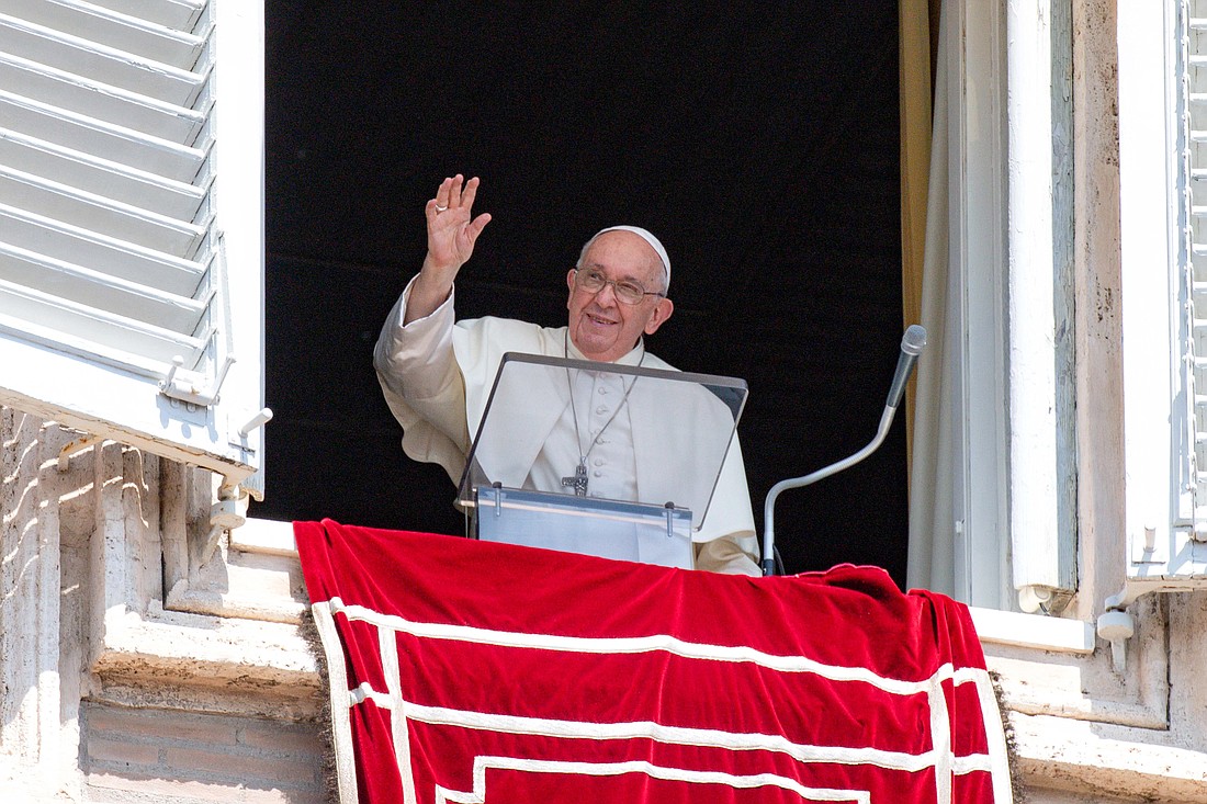 Pope Francis greets visitors in St. Peter's Square at the Vatican to pray the Angelus Aug. 20, 2023. (CNS photo/Vatican Media)