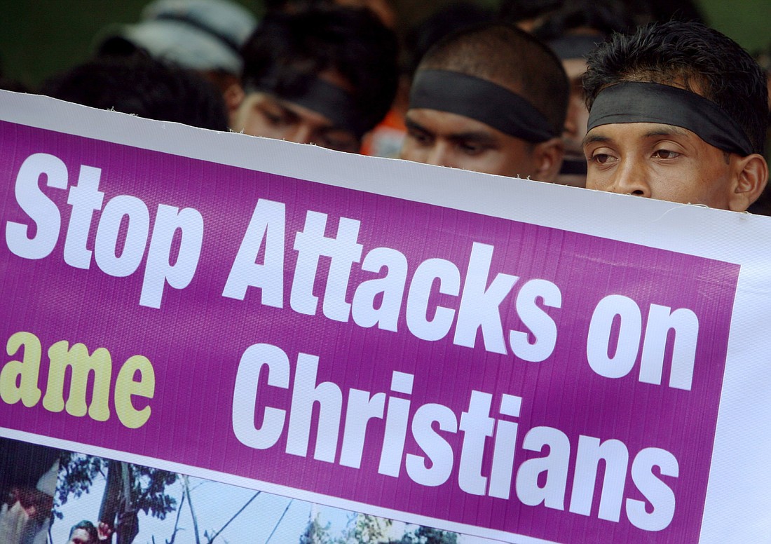 Christians are pictured in file photo holding a banner during a protest in Mumbai, India. On the International Day Commemorating the Victims of Acts of Violence based on Religion or Belief, observed on the United Nations calendar Aug. 22, Pakistan and India are among places of particular concern for Christian rights advocates. (OSV News photo/Punit Paranjpe, Reuters)