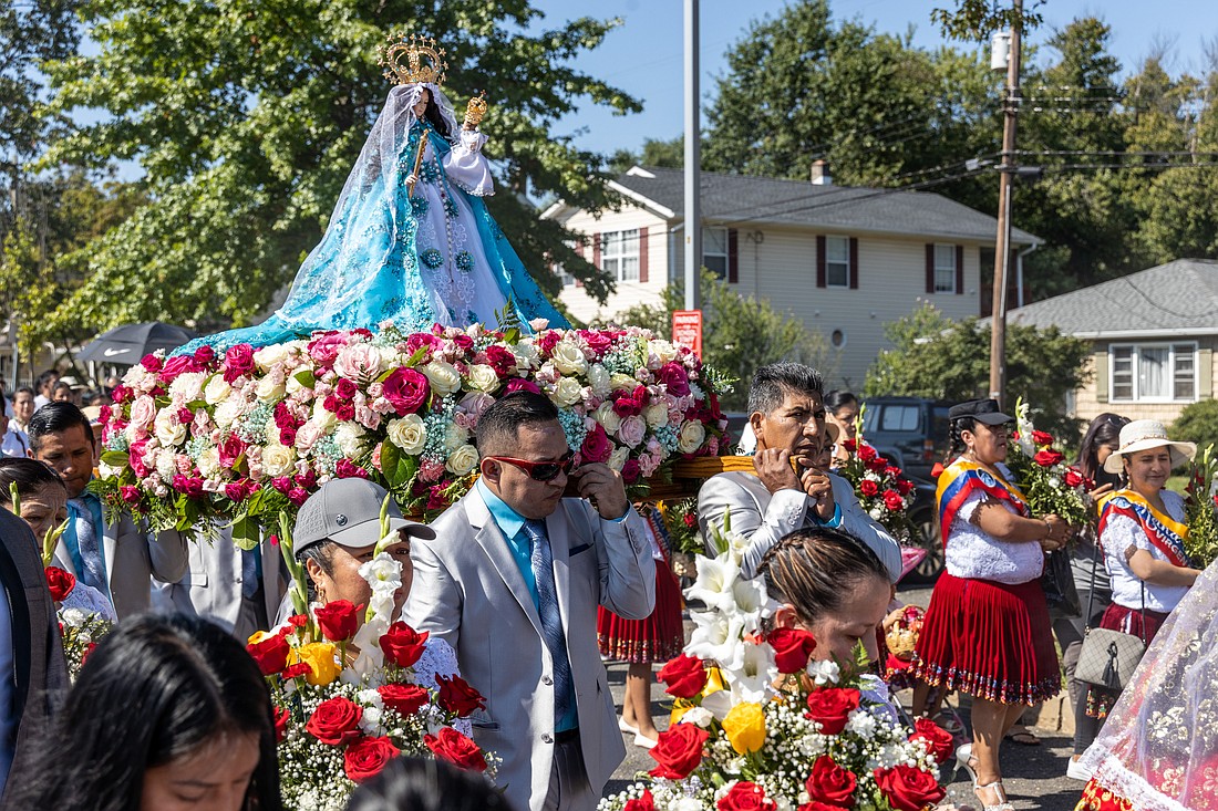 A statue of La Virgen del Cisne is carried in procession as part of an Ecuadorian tradition held in St. Anthony of Padua Church, Hightstown, Aug. 27. Hal Brown photo