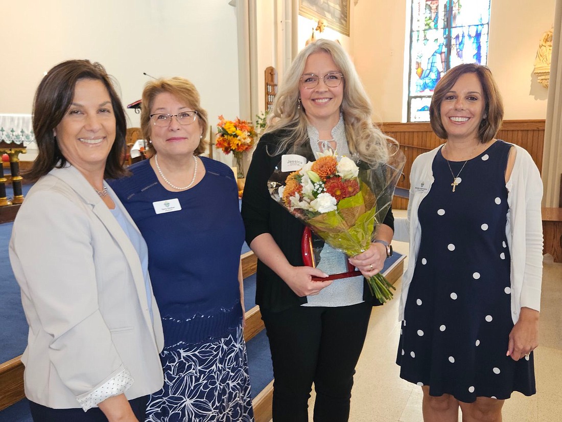Jessica Donohue, parish catechetical leader in St. Joan of Arc Parish, Marlton, was presented with the annual Rosemarie "Chick" McGinty Award during the 2023 PCL Convocation held Sept. 7 in Mary, Mother of the Church Parish, Bordentown. With Donohue are from left, Denise Contino, director of the diocesan Department of Catechesis; Terry Ginther, diocesan chancellor and executive director of the Office of Pastoral Life and Mission, and Michelle Angelo-Santoro, associate director of the Office of Catechesis. Mary Stadnyk photo