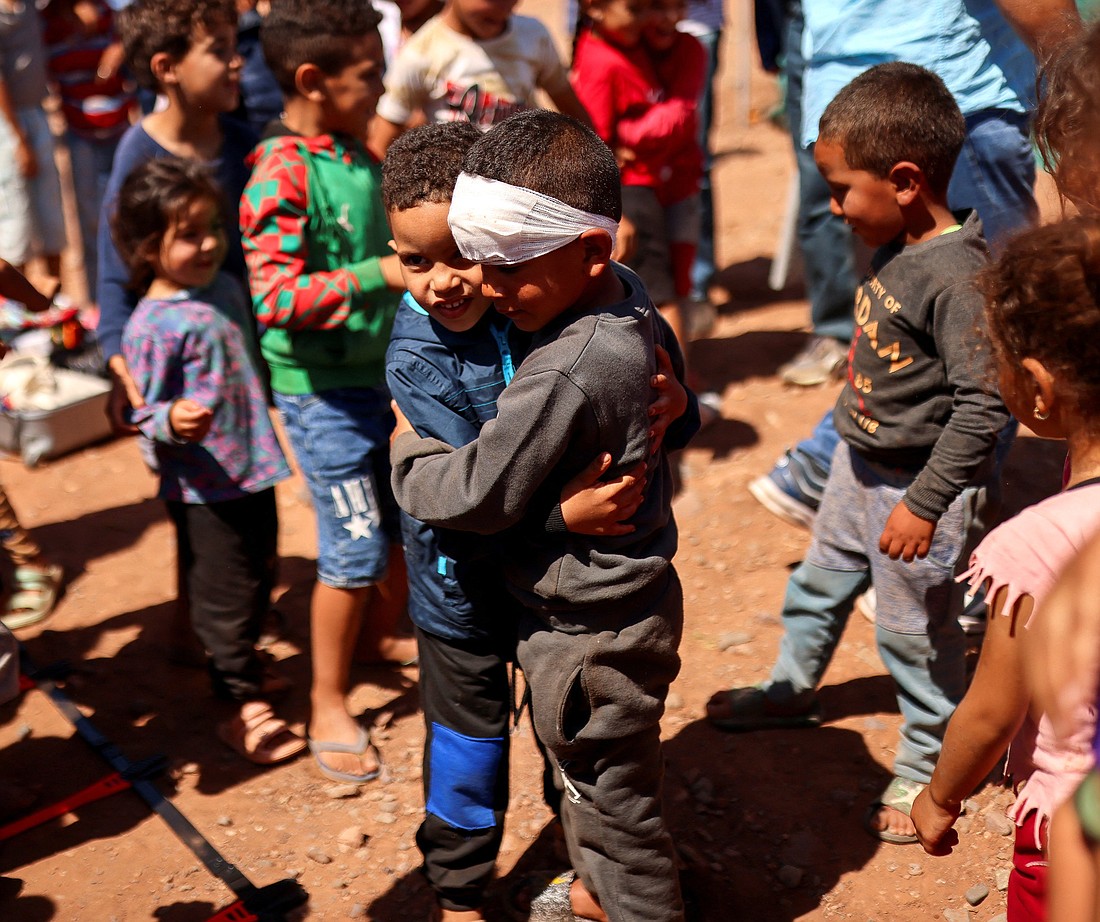 Children play next to a camp for earthquake survivors in Asni, Morocco, Sept. 13, 2023, following a 6.8 magnitude earthquake Sept. 8, which has claimed the lives of thousands and left thousands of others homeless. (OSV News photo/Nacho Doce, Reuters)