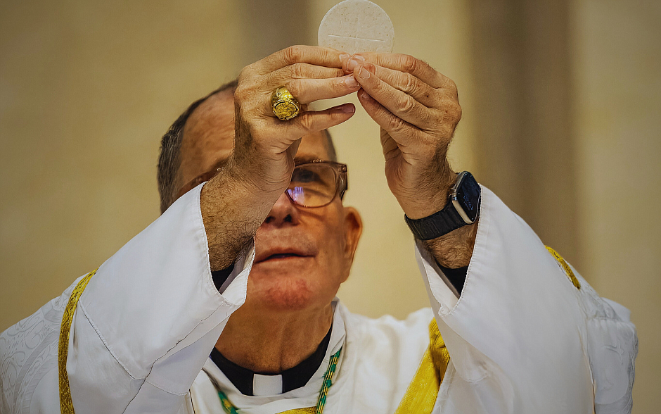 Bishop O'Connell elevates the Eucharist during a Mass he celebrated in St. Robert Bellarmine Co-Cathedral, Freehold. Priests of the Diocese have been invited to submit homilies during the parish phase of the Eucharistic Revival. Hal Brown photo