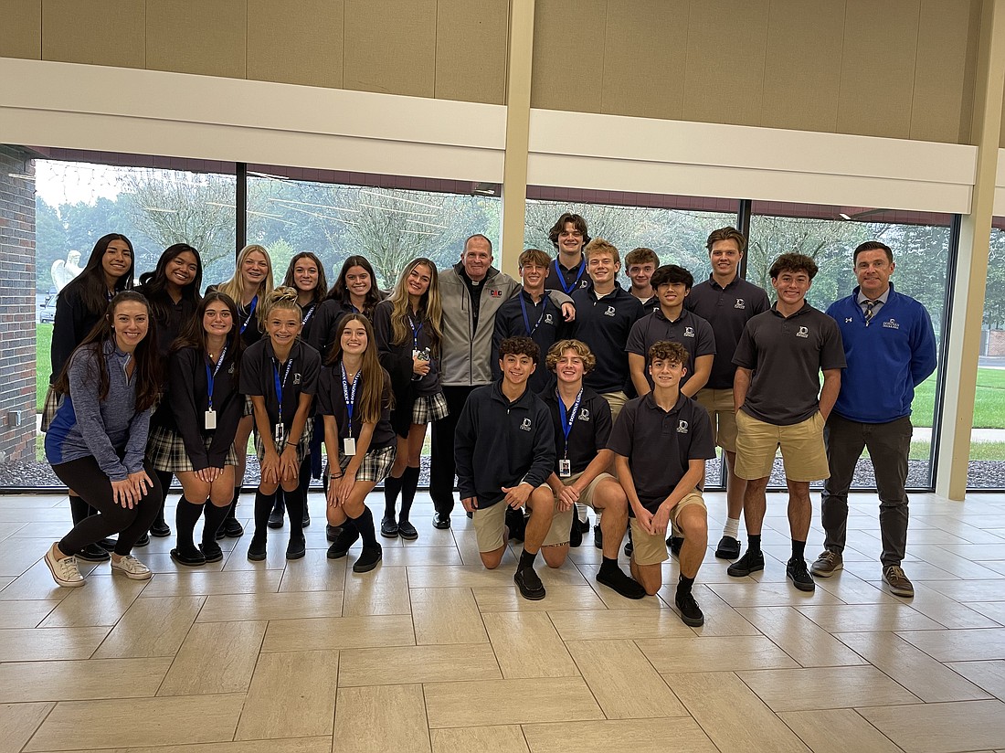 Bishop O'Connell enjoyed meeting students from the various high schools during the Catholic Athletes for Christ Mass and gathering. Here the Bishop poses for a photo with the students from Donovan Catholic High School, Toms River.