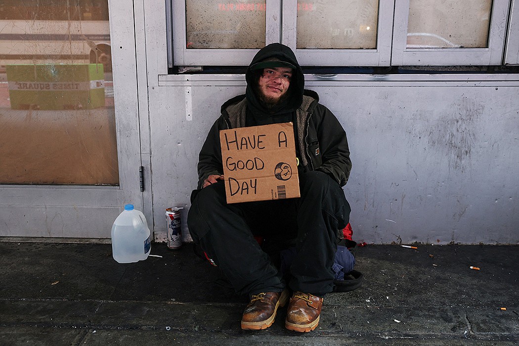 Nathan, 22, originally from Texas, who said he has been homeless since he was 16, sits with a sign along 42nd Street in New York City March 1, 2023. Each year, an estimated 4.2 million youth and young adults experience homelessness. OSV News photo/Shannon Stapleton, Reuters