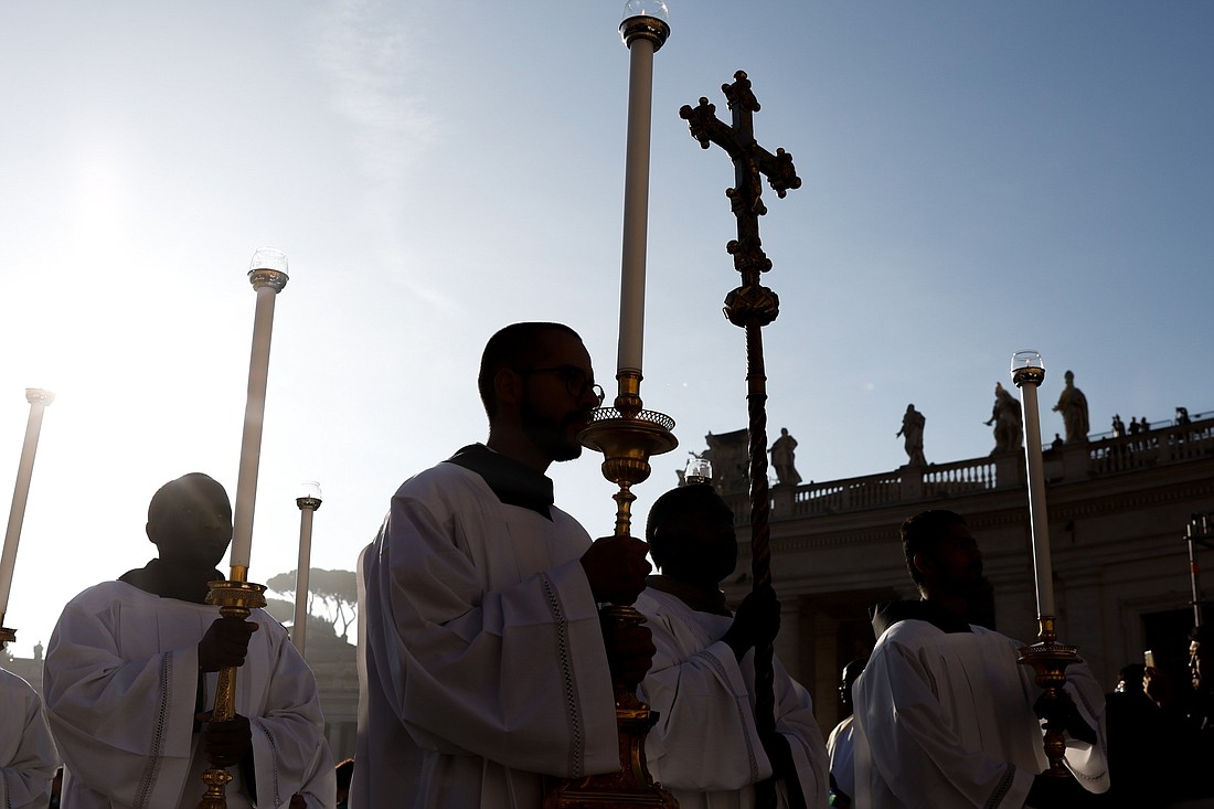 Altar servers lead the procession for Pope Francis’ Mass opening the assembly of the Synod of Bishops in St. Peter’s Square at the Vatican Oct. 4, 2023. (CNS photo/Lola Gomez)