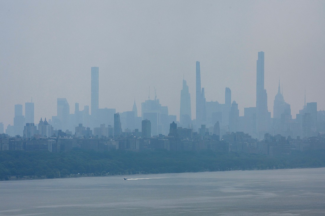 Haze and smoke caused by wildfires in Canada linger over the skyline of midtown Manhattan in New York City as seen from Fort Lee, N.J. June 8, 2023. Wildfires have always occurred, but experts say the warming climate is increasing their severity. In his latest apostolic exhortation, Laudate Deum, issued Oct. 4, Pope Francis speaks of the urgency for society to the global climate crisis seriously.  OSV News photo/Mike Segar, Reuters OSV News photo/Mike Segar, Reuters