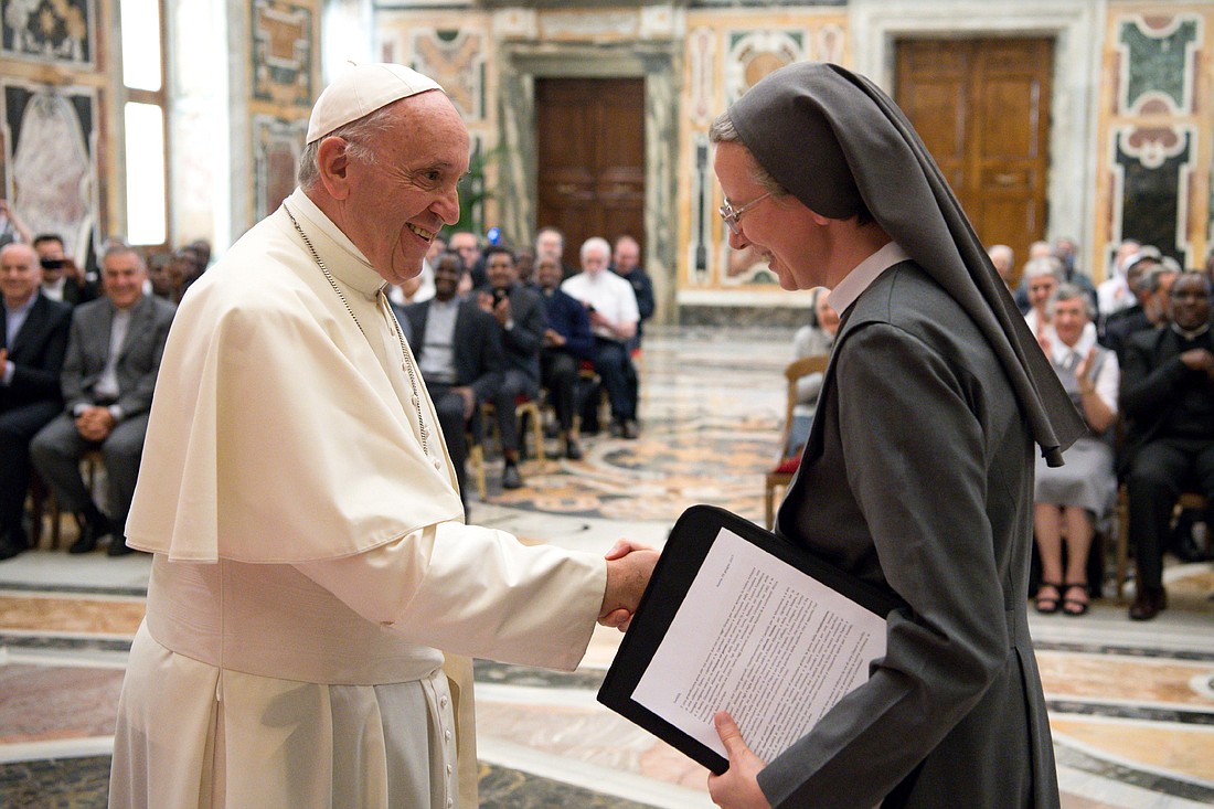 Pope Francis greets Consolata Sister Simona Brambilla, superior general of the Consolata Missionary Sisters, during a June 5 audience with the men's and women's branches of the religious missionary congregation. (CNS photo/L'Osservatore Romano)