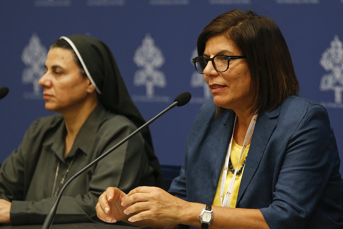 Margaret Karram, the Israel-born Palestinian president of the Focolare movement, speaks to reporters Oct. 12, 2023, during a briefing about the assembly of the Synod of Bishops in the Vatican press office. Also seen is Iraqi Sister Caroline Saheed Jarjis, a member of the Daughters of the Sacred Heart of Jesus. (CNS photo/Robert Duncan)