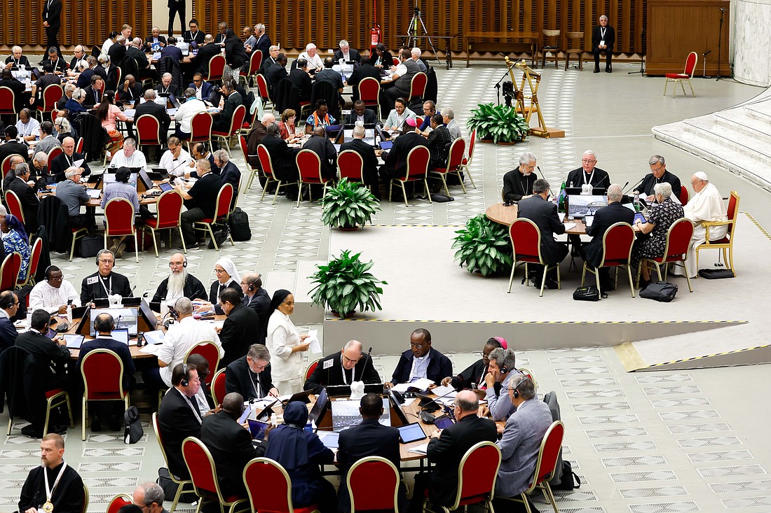 Pope Francis and participants begin a working session of the assembly of the Synod of Bishops in the Vatican's Paul VI Audience Hall, Oct. 13, 2023. (CNS photo/Lola Gomez)