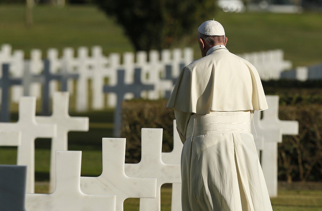 Pope Francis visits graves at the Sicily-Rome American Cemetery in Nettuno, Italy, in this Nov. 2, 2017, file photo. The pope has condemned all war, saying that a just war does not exist. (CNS photo/Paul Haring)