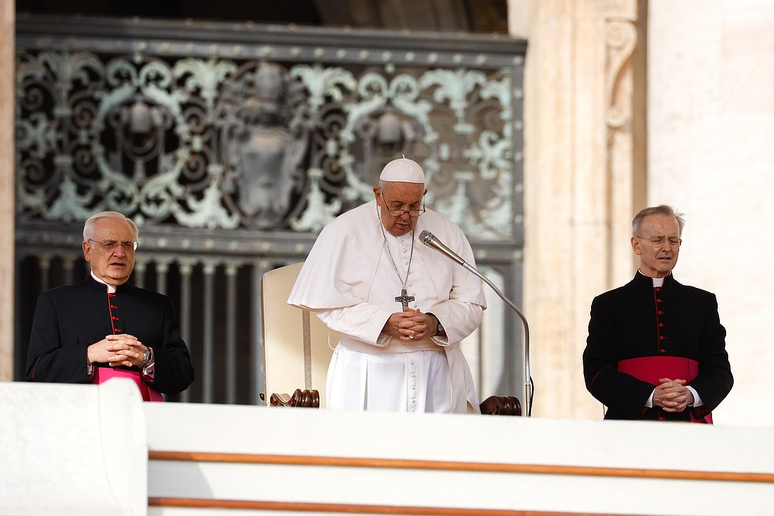 Pope Francis prays during his weekly general audience in St. Peter's Square at the Vatican Oct. 18, 2023. (CNS photo/Lola Gomez)