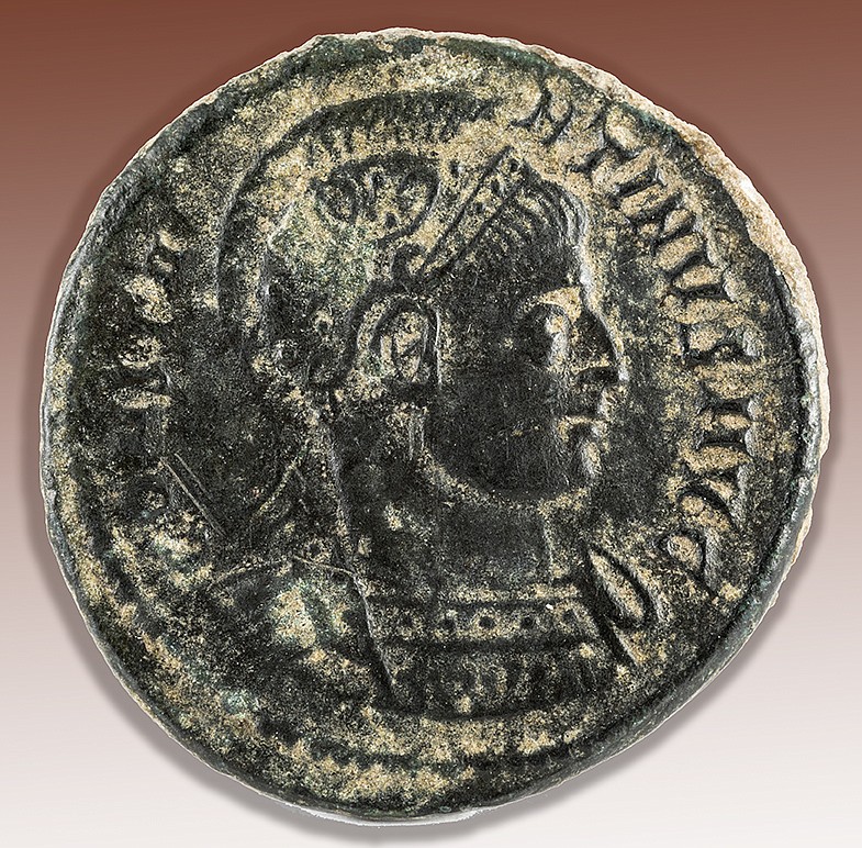 A macro shot of an ancient Roman copper coin of Emperor Constantine I Magnus.