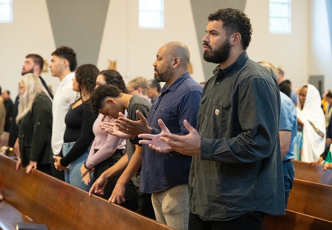 Abraham "Abe" Lucas, an offensive tackle for the Seattle Seahawks, prays during Mass at St. Thomas More Catholic Church in Lynnwood, Wash., Sept. 3, 2023. (OSV News photo/Stephen Brashear, Northwest Catholic)