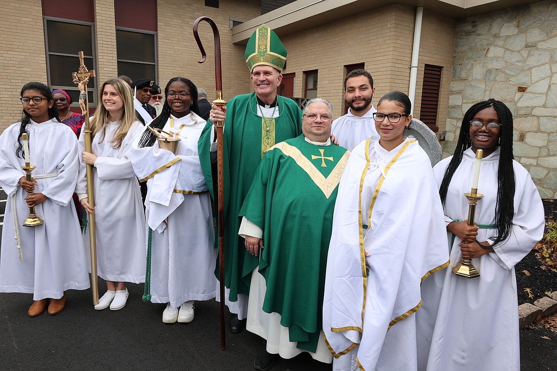 Bishop O'Connell is shown with Father John Testa and the altar servers from Corpus Christi Parish, Willingboro, where the Bishop celebrated Mass Oct. 22 and then blessed a respect life monument that's located on the parish grounds. Ron Maniglia photo