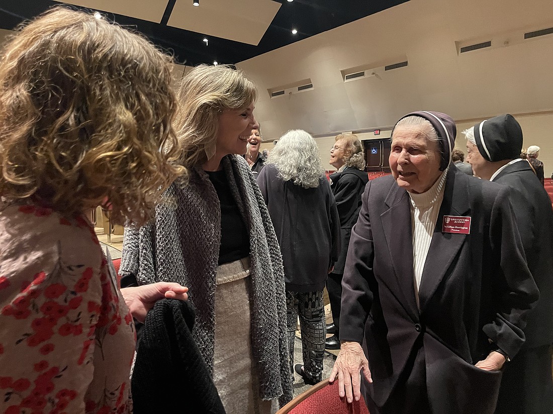 Sr. Lillian Harrington, MPF, President of Villa Victoria Academy, shares memories with members of the Class of 1983. “We have the best teachers here, the best students and the best parents,” she said. Rose O’Connor photo.