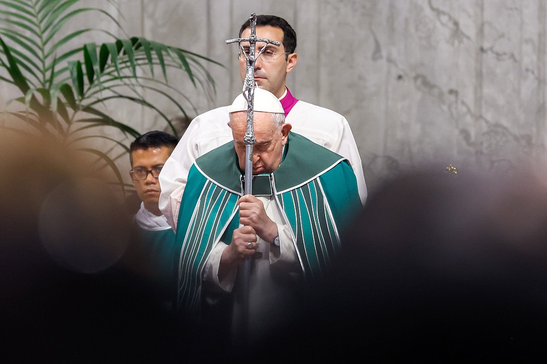 Pope Francis holds his crosier as the Gospel is read during Mass marking the end of the first session of the assembly of the Synod of Bishops on synodality in St. Peter’s Square at the Vatican Oct. 29, 2023. (CNS photo/Lola Gomez)