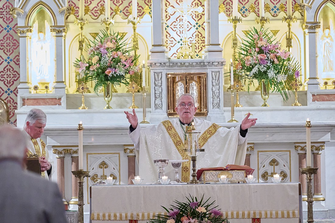 Bishop David M. O'Connell, C.M., celebrates the 4 p.m. Vigil Mass for the Solemnity of All Saints Oct. 31 in St. Michael Church, West End. Joining him at the altar is Father John Butler, St. Michael pastor. Mike Ehrmann photo