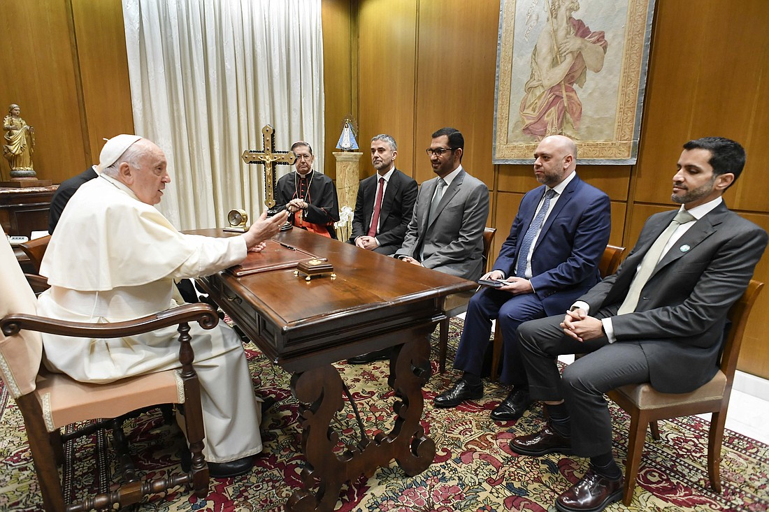 Pope Francis meets Sultan al-Jaber, the president-designate of the 2023 United Nations Climate Change Conference, known as COP28, his delegation and Cardinal Miguel Ángel Ayuso Guixot, prefect of the Dicastery for Interreligious Dialogue, at the Vatican Oct. 11, 2023. COP28 is set to open Nov. 30 in Dubai. (CNS photo/Vatican Media)