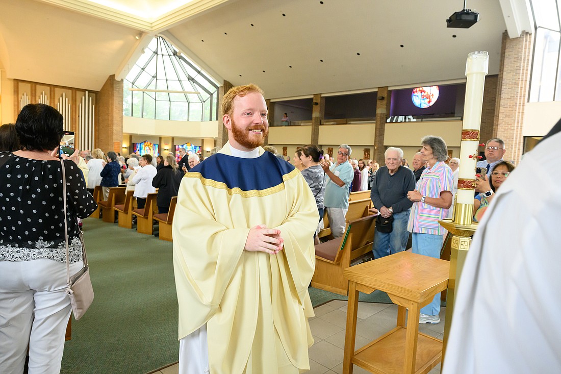 Newly ordained Father Kevin Hrycenko is all smiles on his ordination day in June.  Catholics throughout the world are called to pray for an increase of vocations to the priesthood and religious life during National Vocation Awareness Week. Mike Ehrmann photo