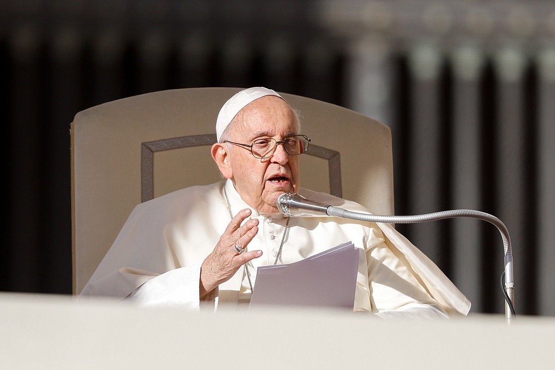 Pope Francis talks to visitors during his weekly general audience Nov. 8, 2023, in St. Peter’s Square at the Vatican. (CNS photo/Lola Gomez)