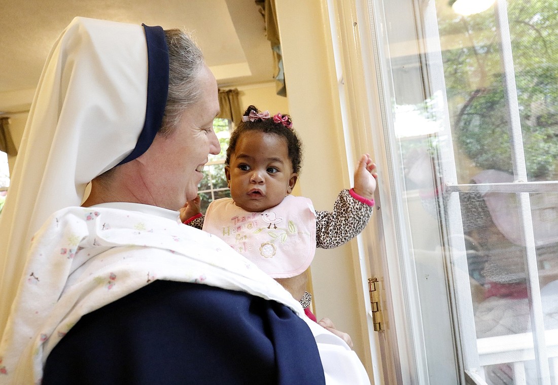 A file photo shows Sister Mary Elizabeth, then vicar general of the Sisters of Life, holding a child at the religious community's Holy Respite residence in the Hell's Kitchen neighborhood of New York City. Holy Respite serves as a home and support center for pregnant women in crisis and new mothers. (OSV News photo/Gregory A. Shemitz)
