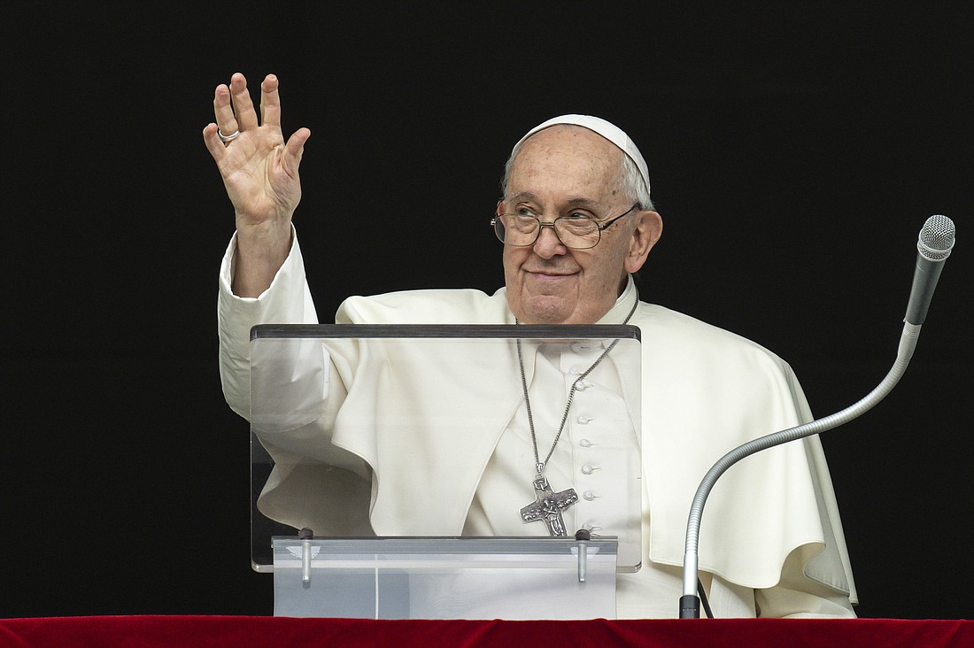 Pope Francis waves to people gathered to pray the Angelus in St. Peter's Square at the Vatican Nov 12, 2023. (CNS photo/Vatican Media)