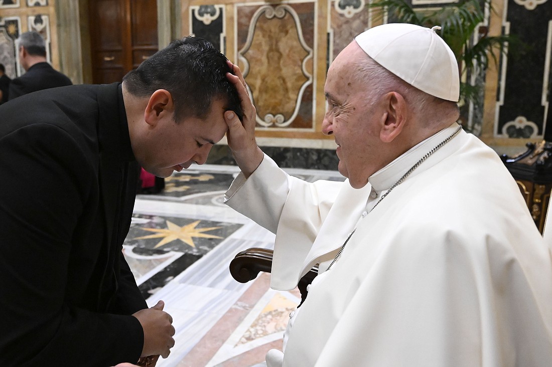 Pope Francis blesses a member of the National Association of Hispanic Priests after a meeting in the Clementine Hall of the Apostolic Palace at the Vatican Nov. 16, 2023. (CNS photo/Vatican Media)