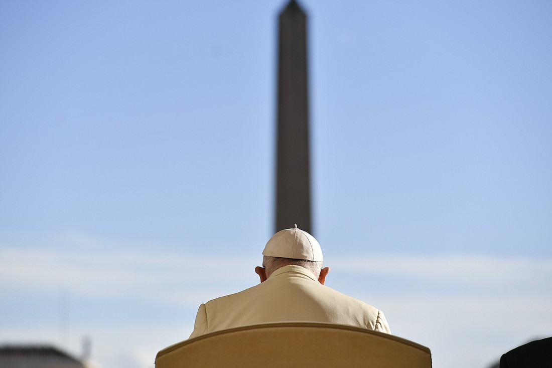 Pope Francis is seated facing the obelisk in St. Peter's Square at the Vatican for his weekly general audience Nov. 22, 2023. (CNS photo/Vatican Media)