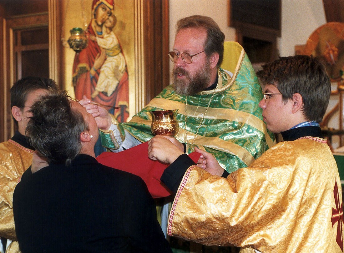 A file photo shows a priest distributing Communion by intinction at a Byzantine Catholic Church. Eastern Catholics prepare for Christmas with the traditional Nativity Fast (sometimes called St. Philip's Fast), a practical preparation for the joyful expectation of Christ's birth. (OSV News photo/James Baca, Denver Catholic Register)