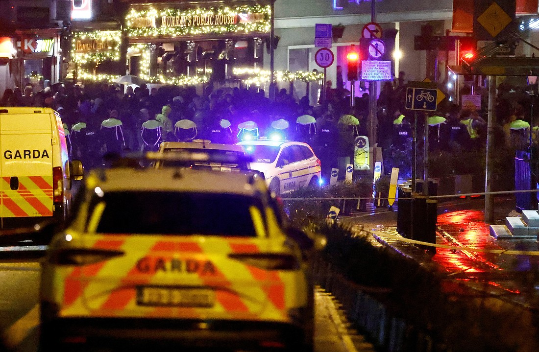 Police officers stand guard near the scene of a stabbing attack that left three children and a teacher injured in Dublin Nov. 23, 2023. The stabbing incident happened outside an Irish language-speaking school called Cólaiste Mhuire, which means St. Mary's College. The school falls within the parish boundaries of St. Mary's Pro-Cathedral, and Archbishop Dermot Farrell of Dublin expressed shock at the stabbing attack. (OSV News photo/Clodagh Kilcoyne, Reuters)