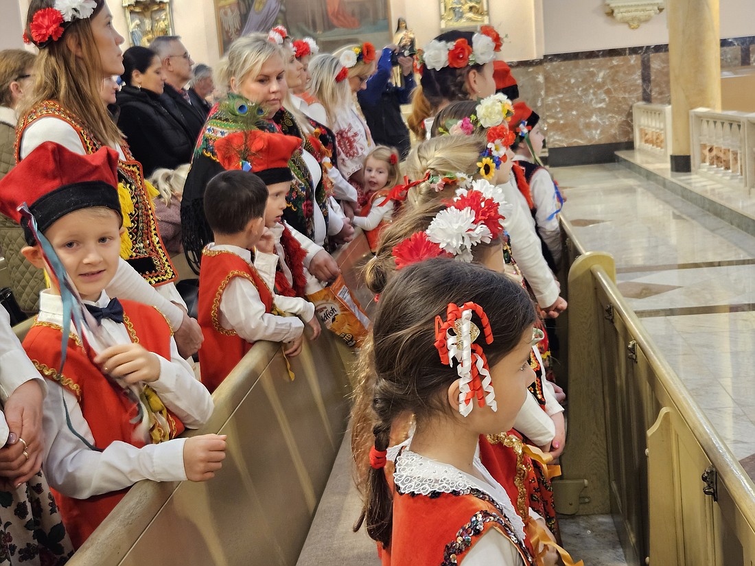 A number of parishioners were dressed in native Polish attire and sat in the front pews for the Mass celebrated by Bishop Andrzej Zglejszewski Nov. 26 in St. Hedwig Church. Mary Stadnyk photos