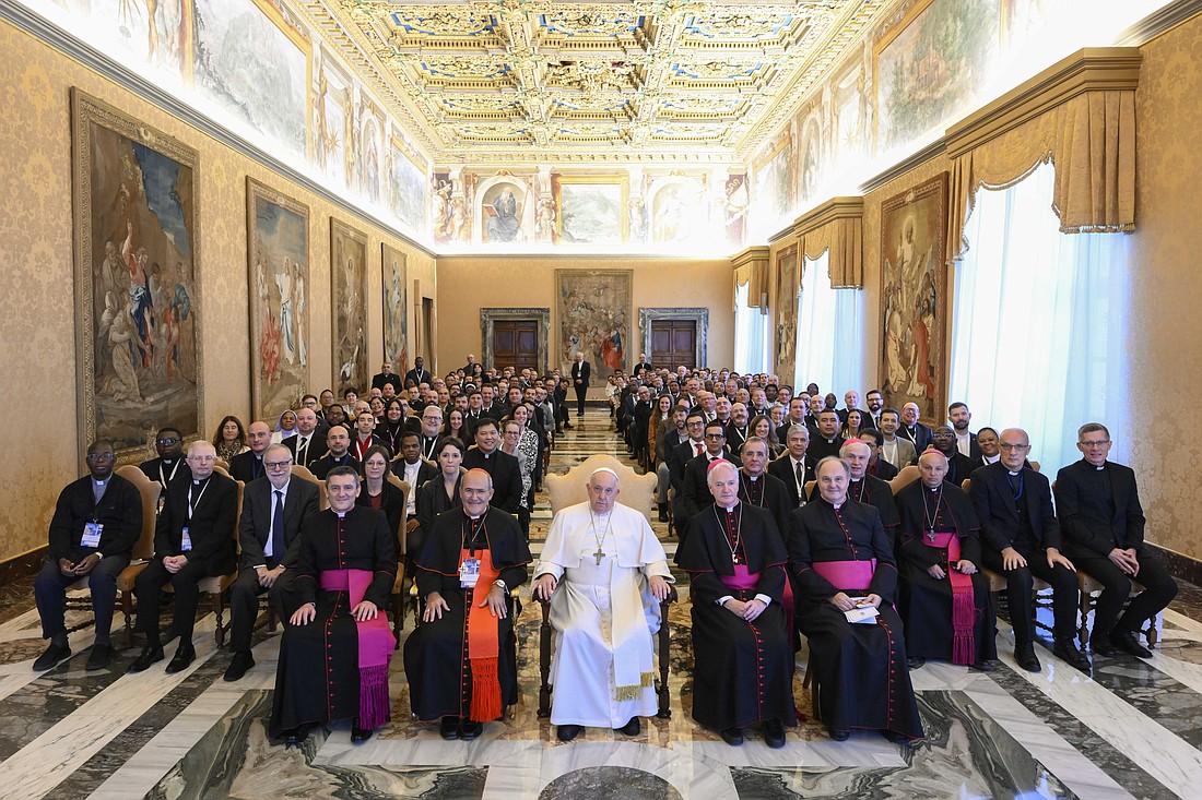Pope Francis poses for a group photograph in the Apostolic Palace at the Vatican Nov. 24, 2023, with university chaplains and pastoral workers who attended a conference sponsored by the Dicastery for Culture and Education. To the pope's right is Cardinal José Tolentino de Mendonça, prefect of the dicastery, and to his left is Bishop Paul Tighe, secretary of the dicastery's culture section. (CNS photo/Vatican Media)