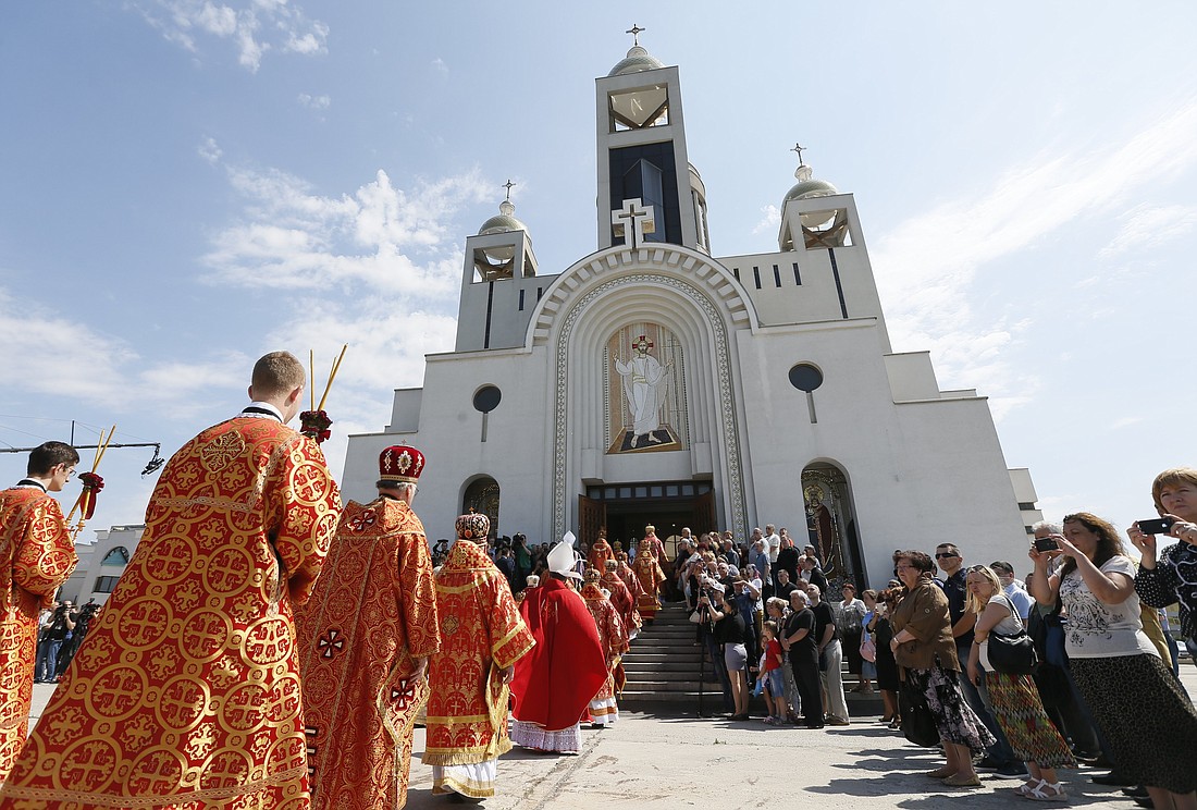 Clergymen into the Patriarchal Cathedral of the Resurrection of Christ in Kiev, Ukraine, June 5, 2017. The cathedral and its curia buildings sustained damage during a massive Nov. 25, 2023, drone attack by Russian forces on Kyiv. (OSV News photo/Valentyn Ogirenko, Reuters)