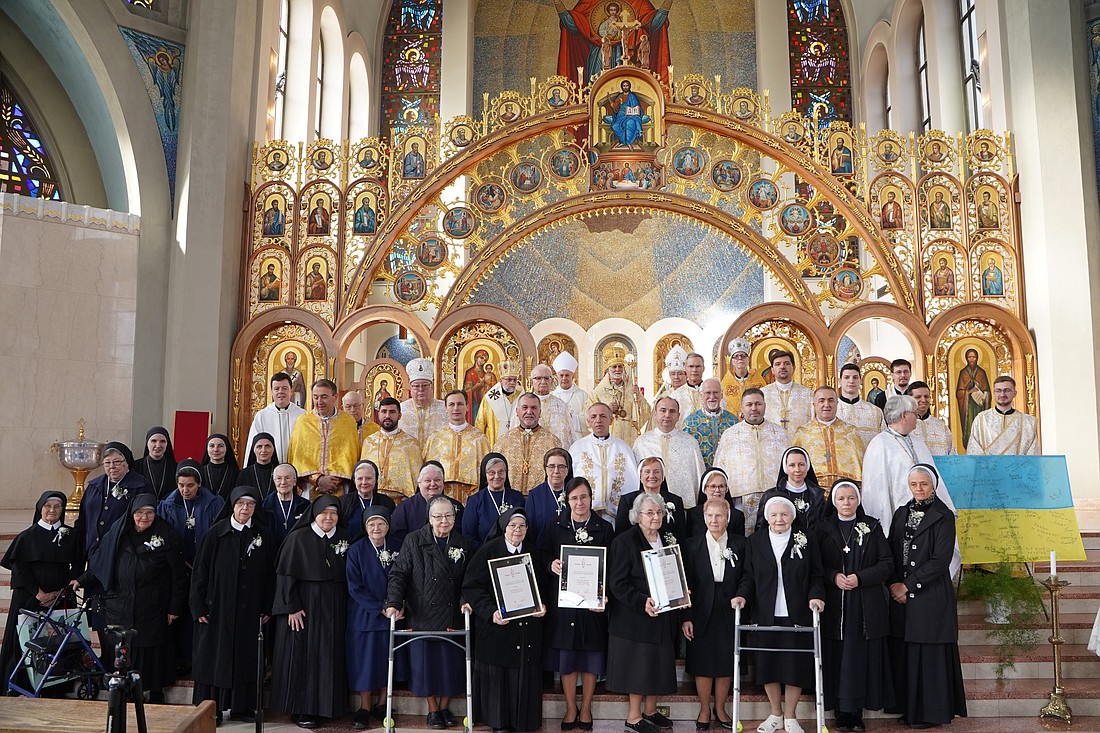 Metropolitan Archbishop Borys A. Gudziak of the Ukrainian Catholic Archeparchy of Philadelphia, center back, poses with other clergy and women religious in a group shot after he presented the 2023 Metropolitan Service Award to the Sisters, Servants of Mary Immaculate of the Immaculate Conception Province in the U.S.; the Jesus, Lover of Humanity Province of the Sisters of the Order of St. Basil the Great; and the Missionary Sisters of the Mother of God following a Nov. 24 Diving Liturgy at the Ukrainian Catholic Cathedral of the Immaculate Conception in Philadelphia. (OSV News/Halyna Vasylytsia/Archeparchy of Philadelphia)