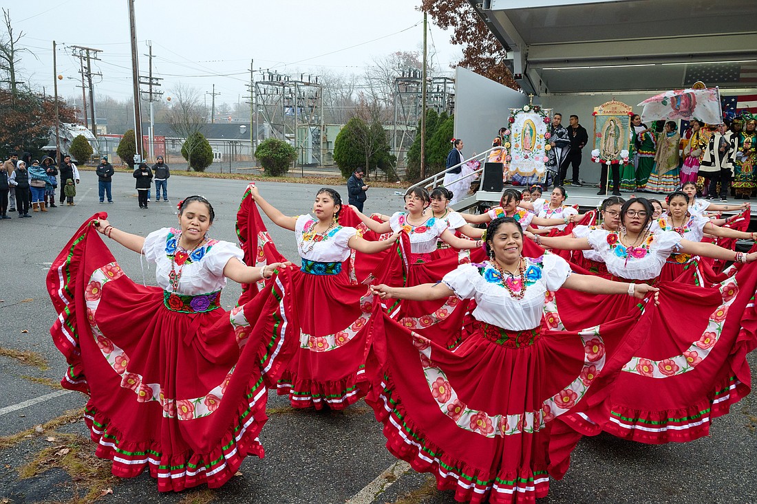A group of dancers perform before the start of the 2023 procession in Lakewood. Mike Ehrmann photos