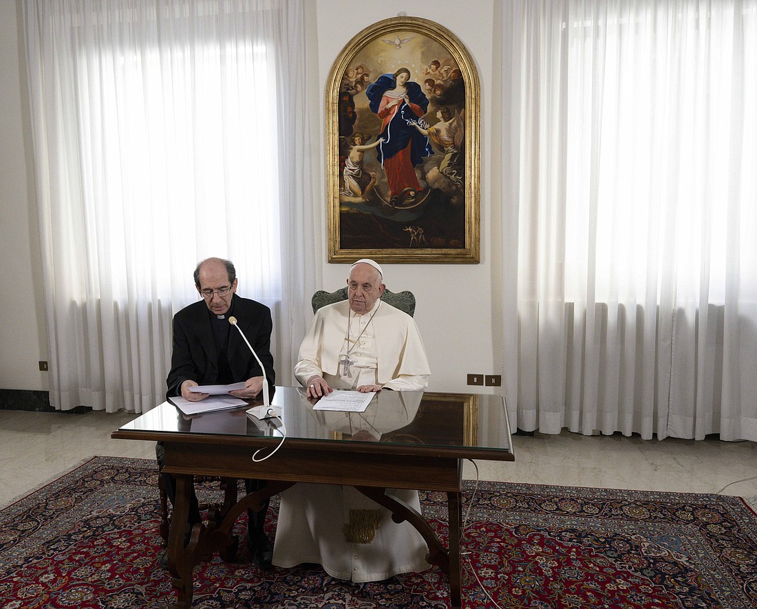Pope Francis listens as Msgr. Paolo Braida, an official at the Vatican Secretariat of State, reads his Angelus reflection, his appeal for a renewed cease-fire between Israel and Hamas and his prayer for the victims of a bombing at a Catholic Mass in the Philippines Dec. 3, 2023. As Pope Francis is currently recovering from bronchitis, he led the Angelus from his Vatican residence, the Domus Sanctae Marthae. (CNS photo/Vatican Media)