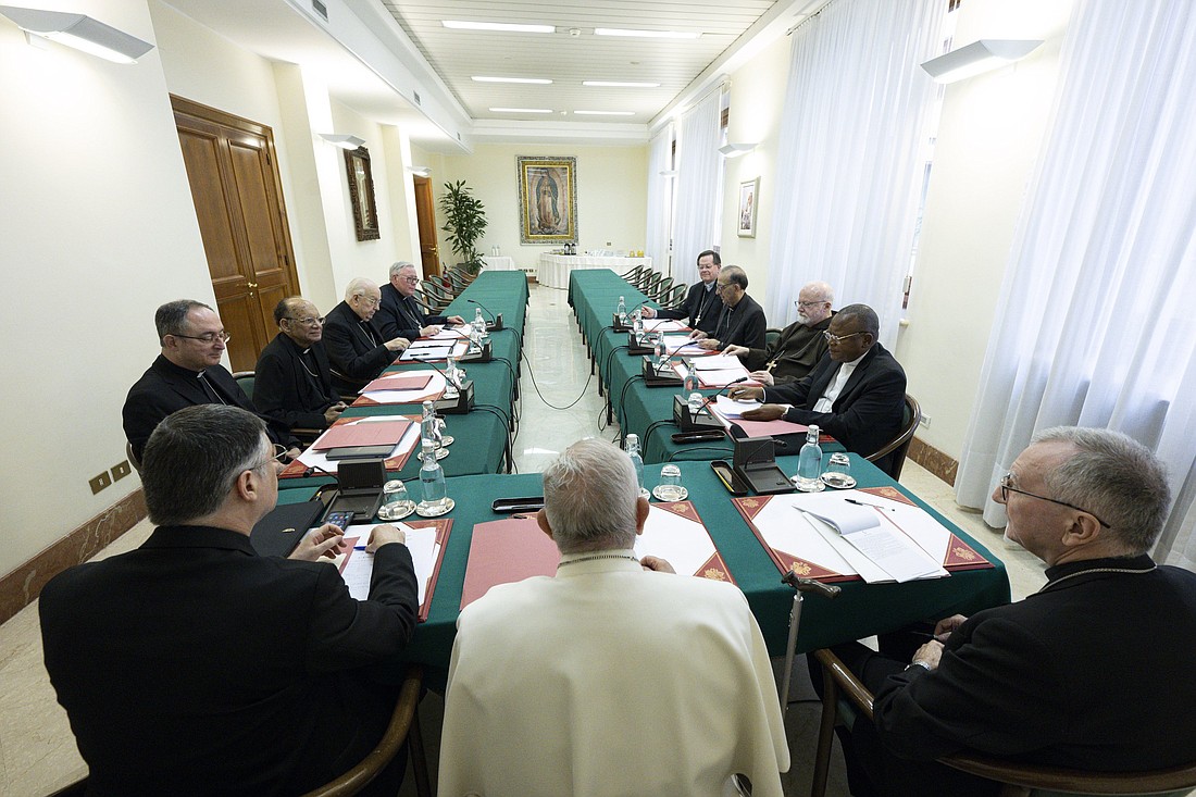 Pope Francis meets with the members of his renewed Council of Cardinals at the Vatican April 24, 2023. Seated on either side of the pope are Bishop Marco Mellino, council secretary, and Cardinal Pietro Parolin, Vatican secretary of state. The members, clockwise from the left, are: Cardinals Sérgio da Rocha of São Salvador da Bahia, Brazil; Oswald Gracias of Mumbai, India; Fernando Vérgez Alzaga, president of the commission governing Vatican City State; Jean-Claude Hollerich of Luxembourg; Gérald C. Lacroix of Québec; Juan José Omella Omella of Barcelona; Seán P. O'Malley of Boston; and Fridolin Ambongo Besungu of Kinshasa, Congo. (CNS photo/Vatican Media)
