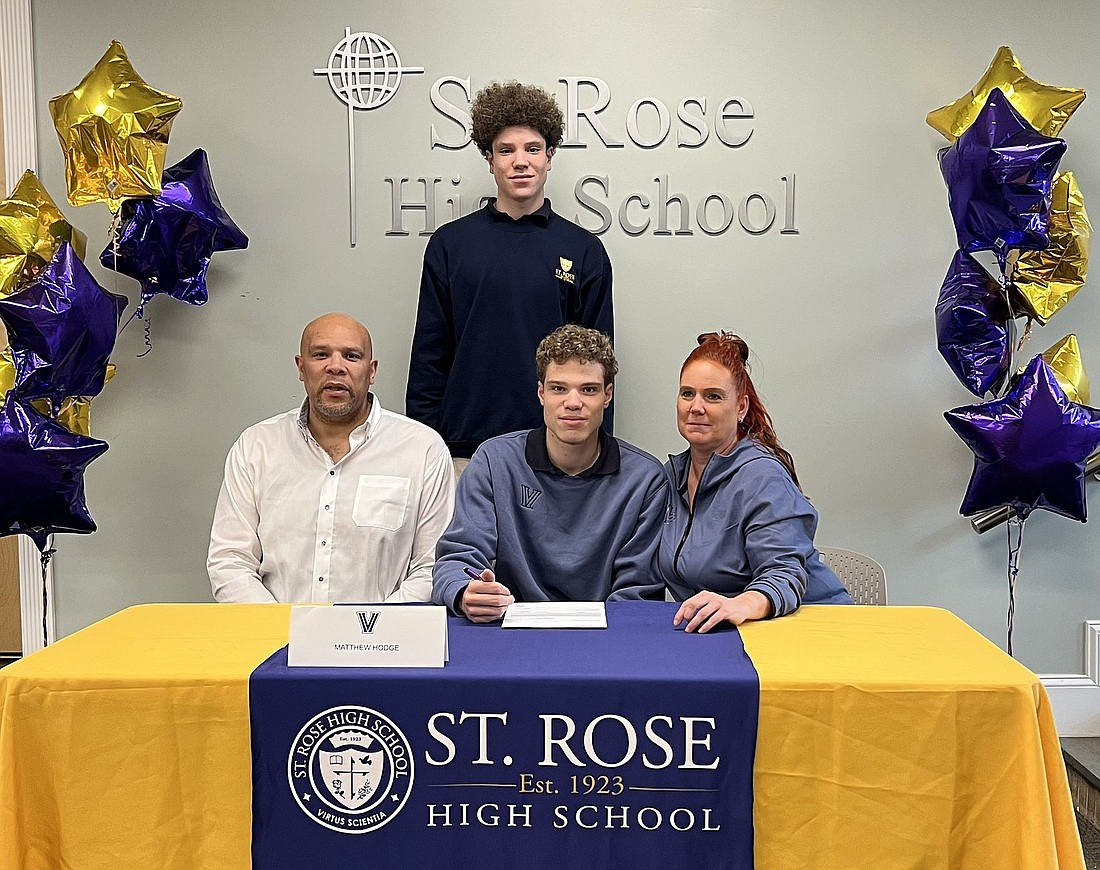 Joined by his brother/teammate Jayden (rear) and his parents; St. Rose, Belmar basketball standout Matt Hodge signs his Letter of Intent to play for Villanova next season. The Hodge brothers combined to average 27 points and 14 rebounds while garnering 147 assists and 93 steals in St. Rose's run to the state final last year. Photo from X (Twitter).