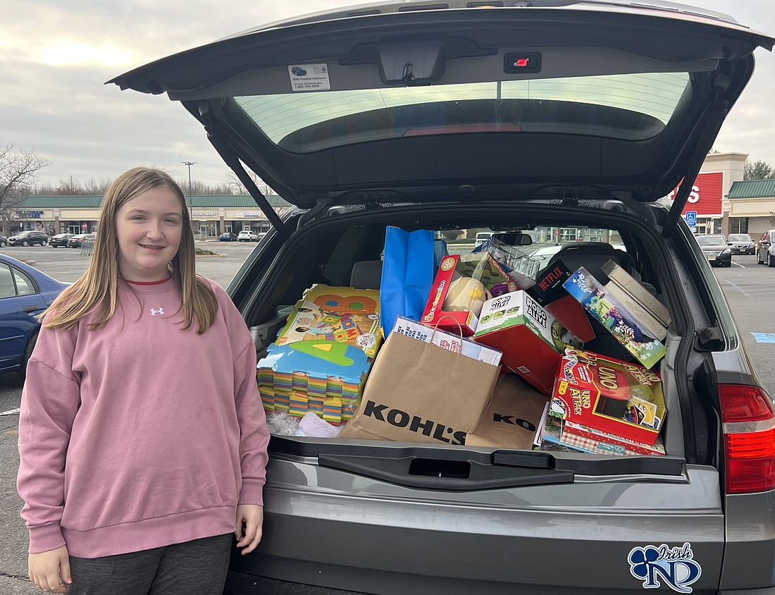 Toy donations purchased by Kyleigh Hillsdon for children receiving medical care fill one of two family cars. Courtesy photos