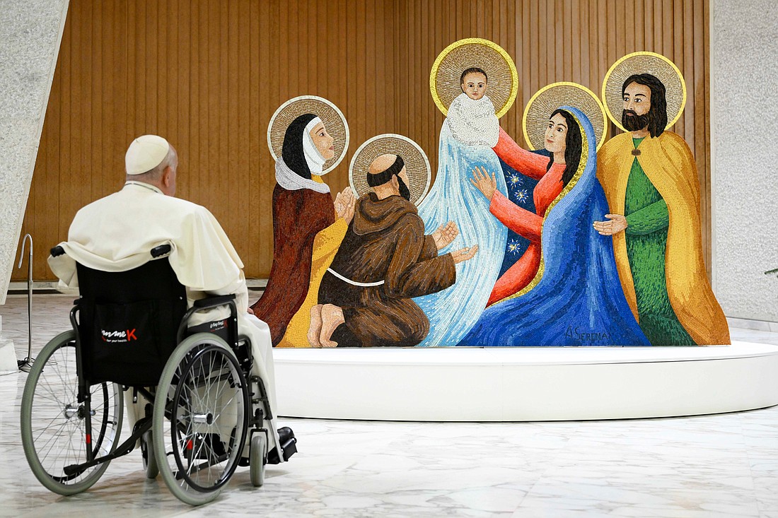 Pope Francis stops to pray in front of a Nativity scene in the Paul VI Audience Hall at the Vatican Dec. 9, 2023. The Vatican announced the Holy Father's schedule of liturgies during the Christmas season. (CNS photo/Vatican Media)