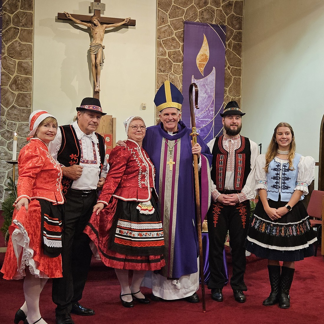 Bishop O'Connell and members of the Slovak community pose for a photo in the sanctuary of St. Michael Church. Mary Stadnyk photo